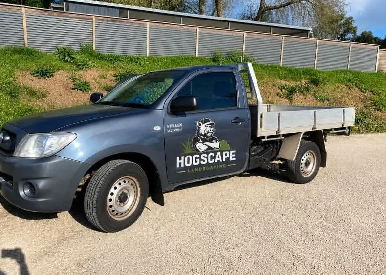 The HogScape grey Hilux tray ute with the hog on the door